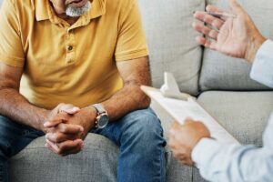man consulting with therapist